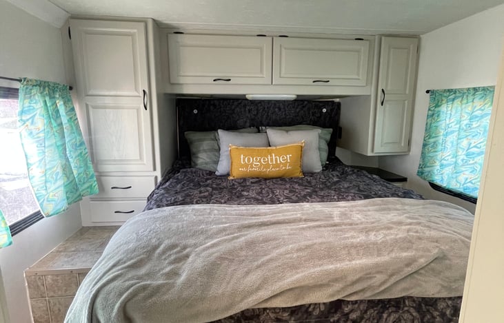 Queen size bed with padded headboard