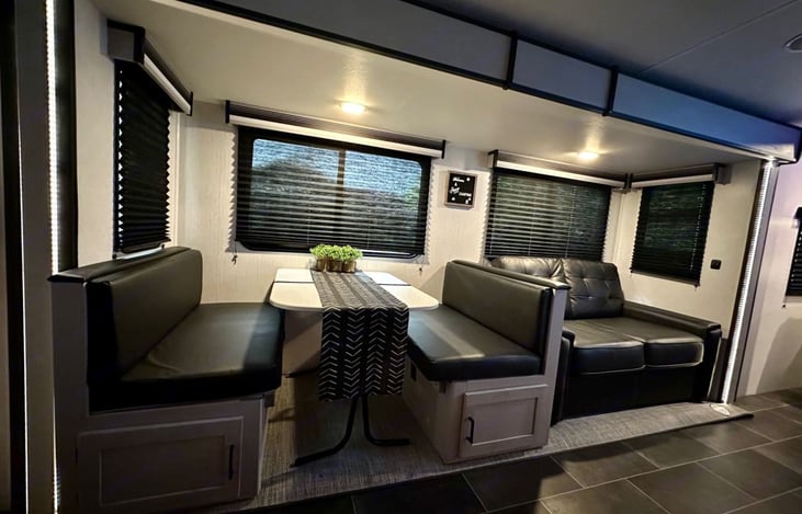 Dining room table with chairs which can be converted into additional sleeping space