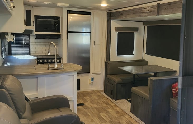 Kitchen and dining area. Storage under seats and table converts to bed!