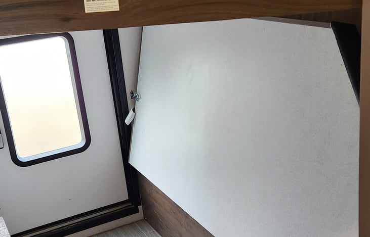 Fold up the bottom bunk and have access to the rear door