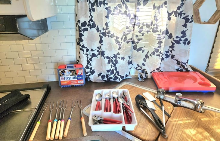 Utensils, smore sticks and portable fire pit included just need wood. Small grill and table per request.