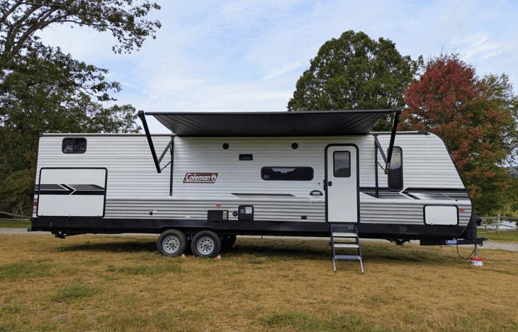 Family-friendly 2022 Coleman Lantern 334BH sleeps 9 w/ a private bunkhouse and 2 slide-outs. Modern, bright and spacious, features outdoor kitchen, large fridge, power awning, ample storage, and more.