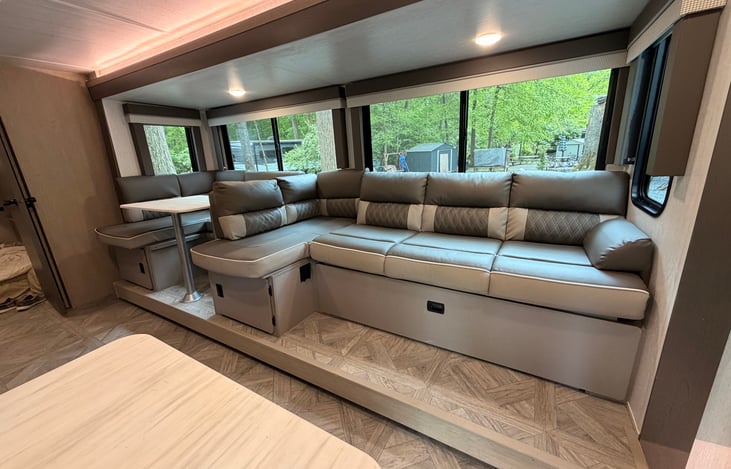 Couch in larger position with the versa lounge. Storage underneath