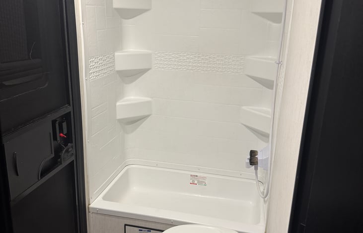 Full bathroom with shower and tub.