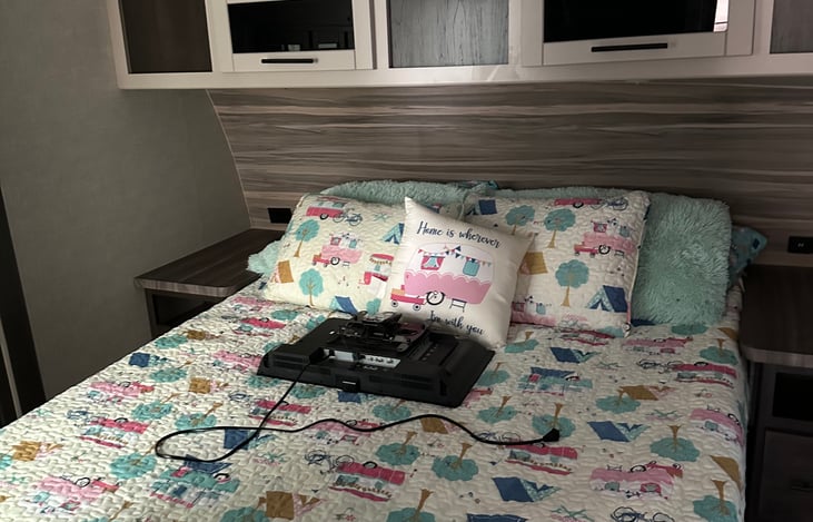 Queen bed with bedding