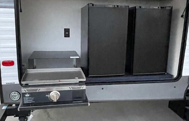 Outside cooktop and 2 refrigerators.