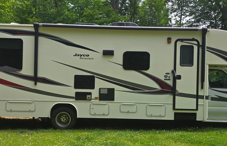 Passenger side camper door and awning