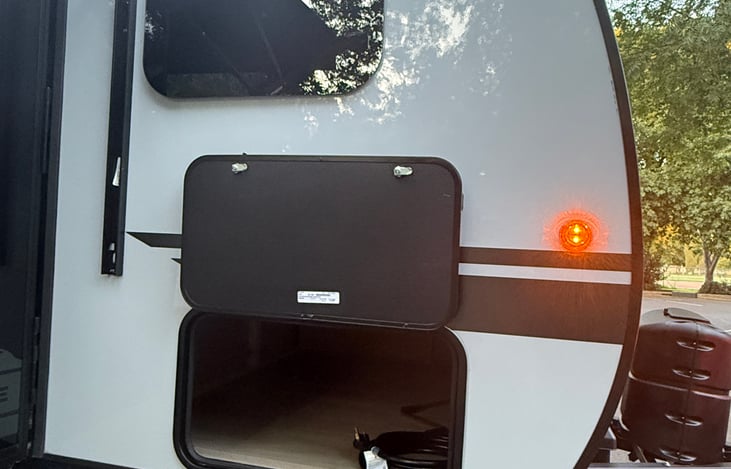 Front storage area - cords, hoses and sewer attachments stored here.