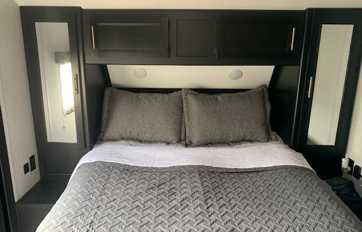 Queen bedroom with dual closets and separate entry door