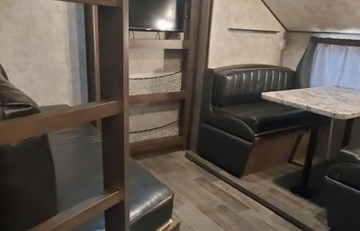 Bunk area with, bed stored and play room setup