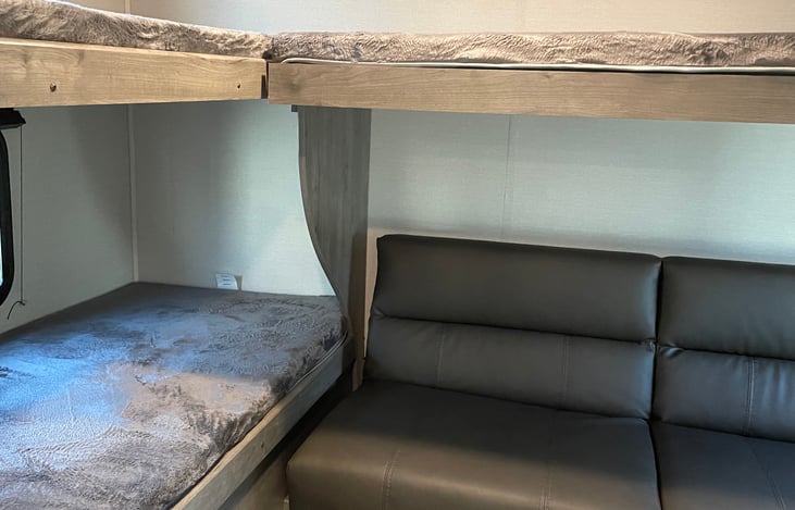 Bunkhouse includes three twin rv beds and a full futon.