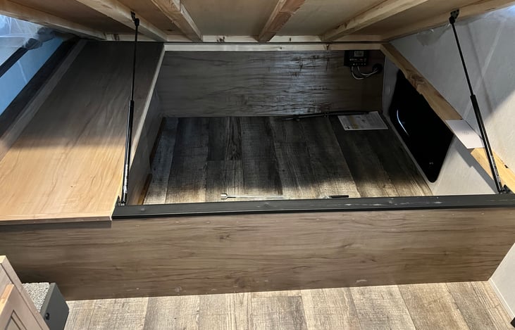 Additional storage under the queen bed