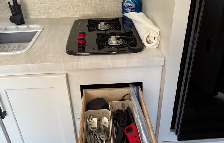 2 burner stove (but serious camp cooking is better down outside the camper)