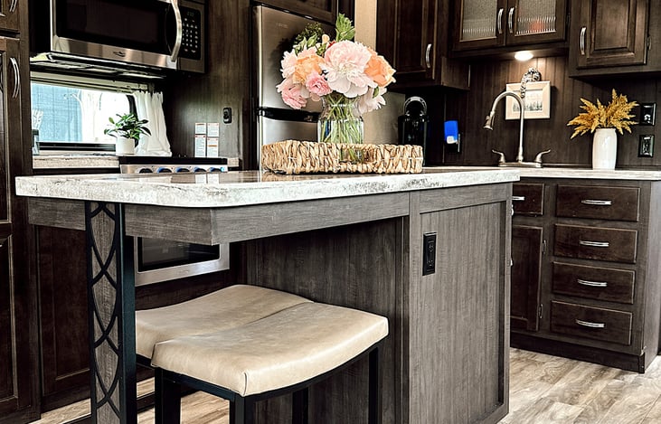 Large center island with bar seating and ample counter space.