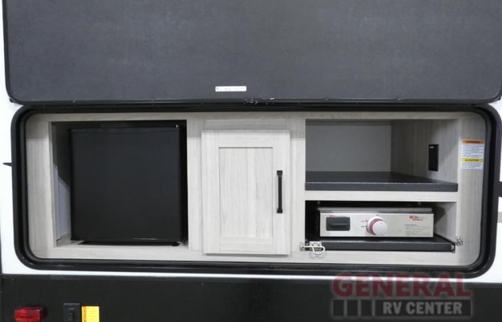 Spending time outside is more enjoyable with a mini fridge and gas griddle for cooking.