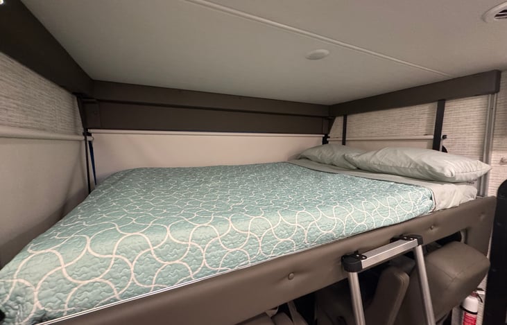 Overhead full bunk with extra gel foam mattress topper.  Good for two adults or kids