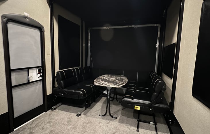 Garage / toy hauler section with two queen beds.  This is bottom queen bed folded out into the couch / diner table feature