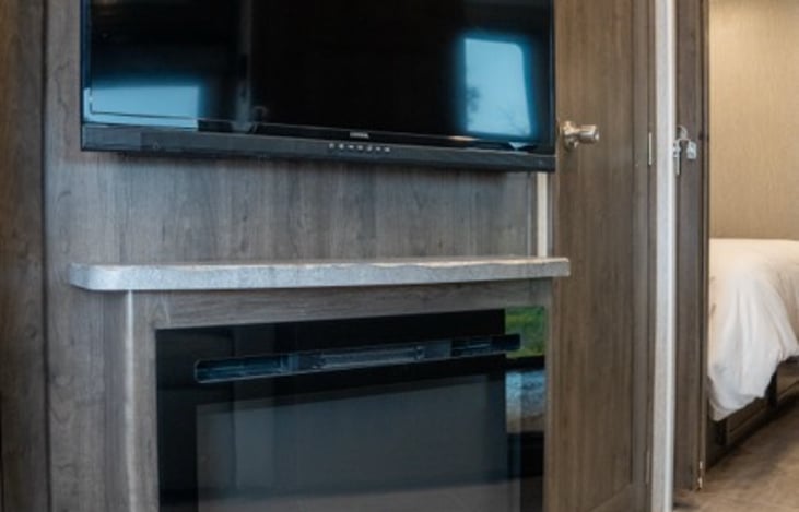 TV and fireplace make for the perfect way to unwind.