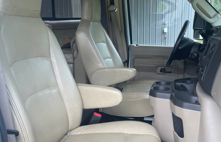 Comfortable front leather seats, drivers seat can be spun around for additional livingroom seating while parked!