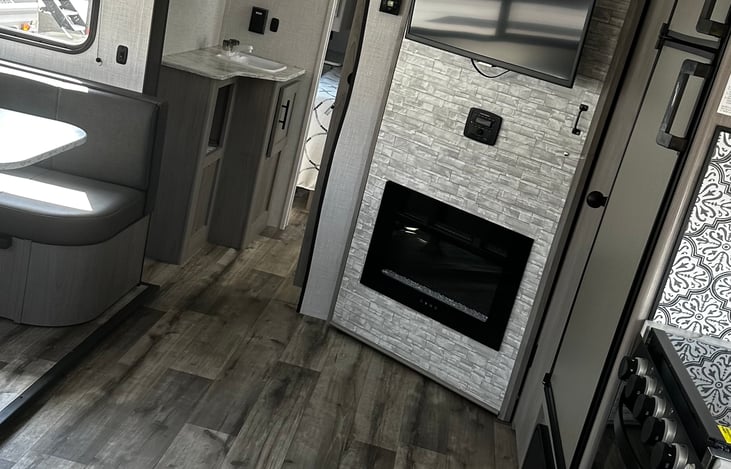 Living area and the restroom is where the sink is on your way to the master bedroom .