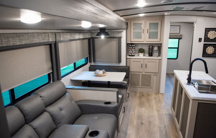 The dining table can convert into a full-size sleeping area. Enjoy coffee with supplied Keurig and pods.