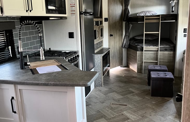 Entire back end of trailer showing bunk beds.