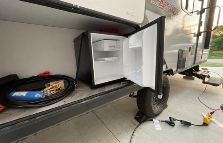 The glorious mini fridge! freezer will hold up to 20 freeze pops and fridge will hold and keep any beverage nice and cold. Please be advised this mini fridge only works while connected to shore power.