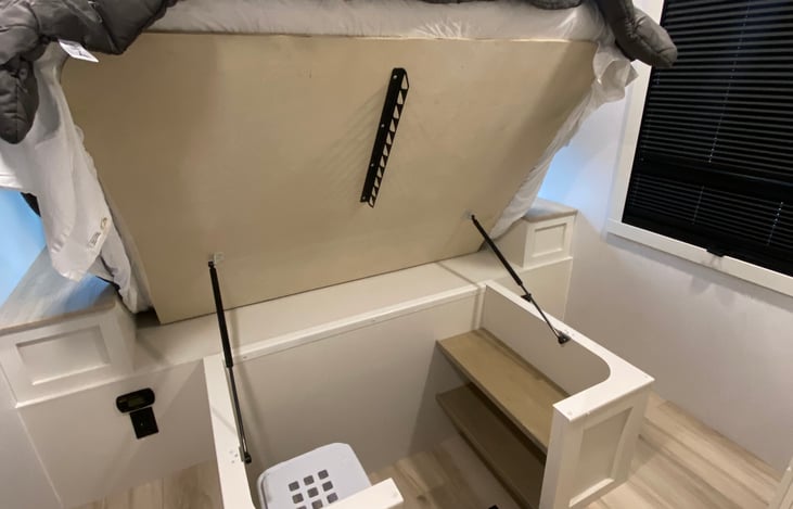 Hidden walk in closet with clothes basket for linens !!