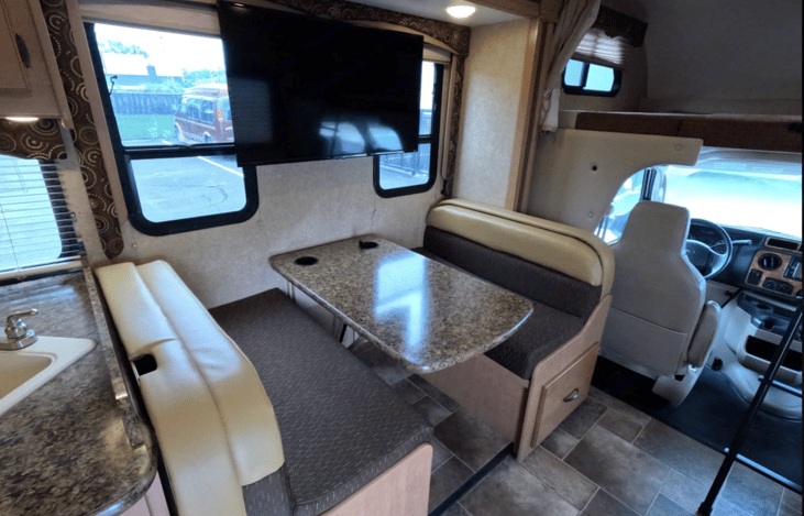 Table booth folds down to a bed.