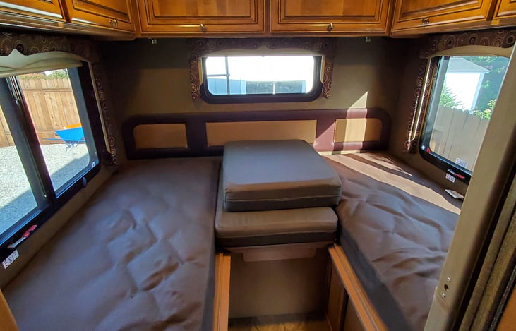 Bed configured as 2 twins with a walk way. Picture without bedding/linens added.