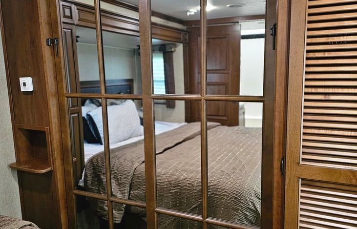 Mirrored closet in master bedroom
