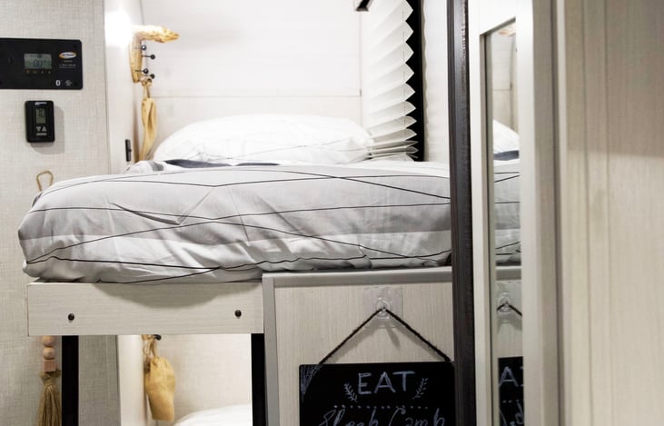 Bunks with small shelf/hooks to hang bags or keep phone, wallet etc. Extra USB ports to charge electronic devices overnight. Bedding, pillows, duvets provided. Hangers and baskets in the closet space.