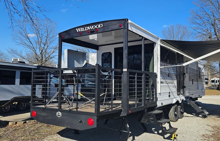 Covered porch with bluetooth speakers and water misters