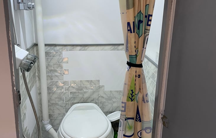 Shower, toilet and shampoo and soap dispenser.