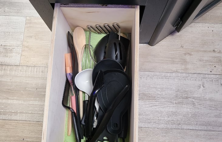 Cooking utensils in the fully stocked kitchen