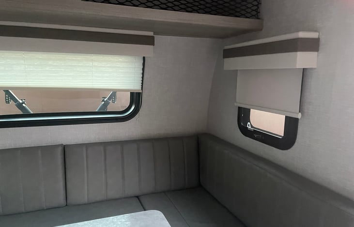 Large square Dining area converts to queen size bed.