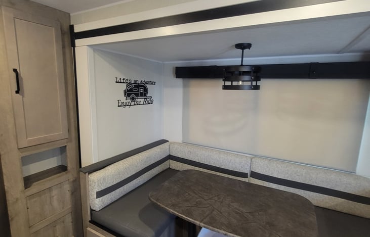 Dining table that converts to a full bed.