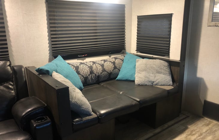 Daybed or converts to a booth dining area.