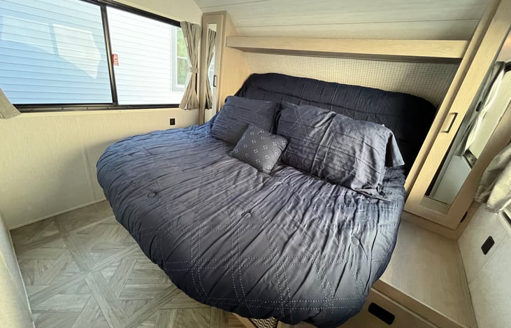 King sized verse tilt bedroom. Separated by a door from the living space of the trailer
