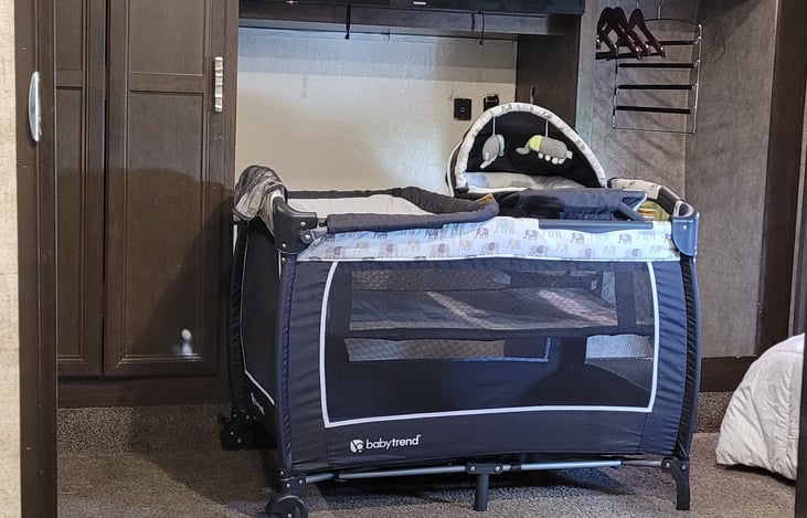 pack n play available for family with a young child complete with changing area.