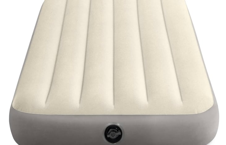 A twin-sized air mattress is included with bedding and an air pump.