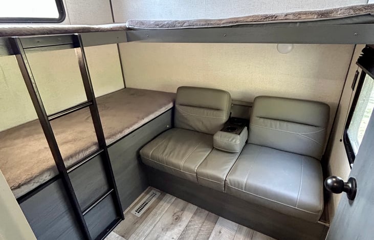 Bunkhouse with a door. 3 bunks, and the sofa can lay flat for additional sleeping room