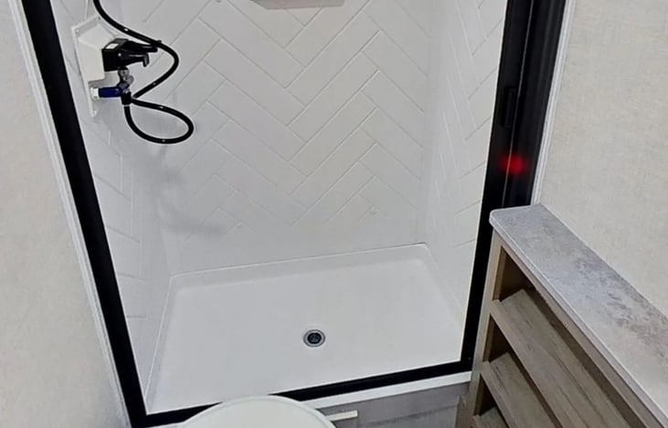 Shelves for extra storage, toilet, full bathroom