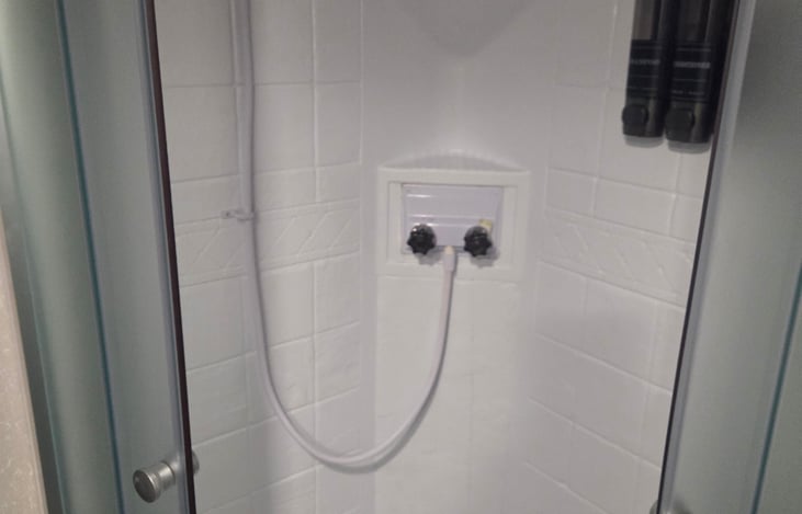 Full size shower with domed skylight for extra room