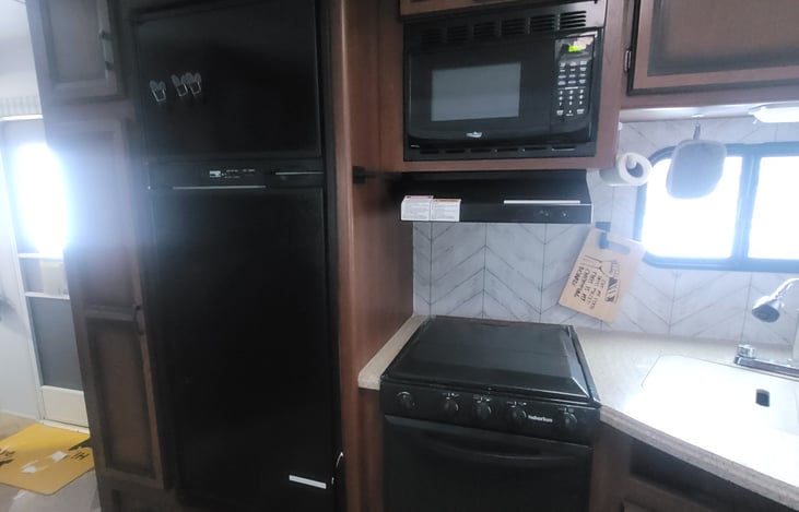 cook top, oven microwave and large fridge