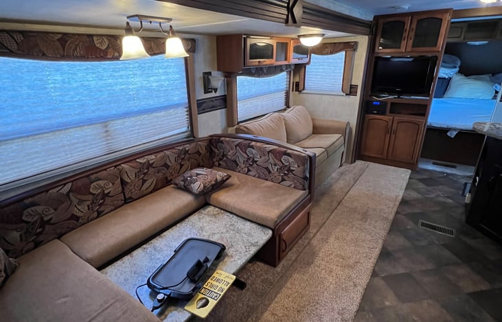 living area. Kitchen table folds down to bed. as well as couch