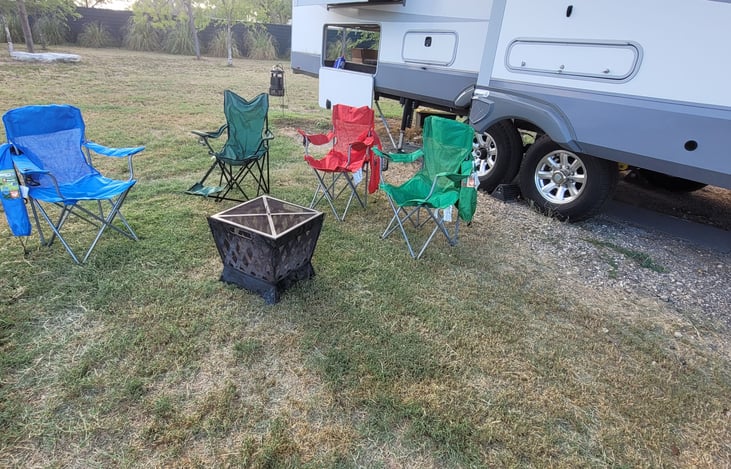 collapsible fire pit with 4 camping chairs