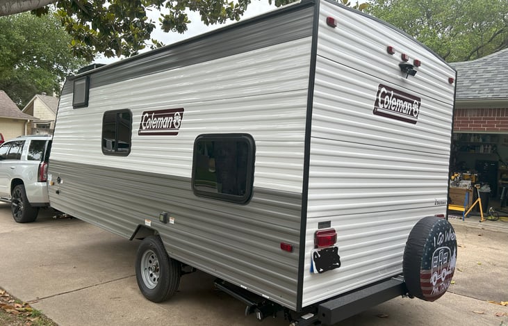 Side and Back view of camper. *Notice rear view backing camera that comes with camper rental.*