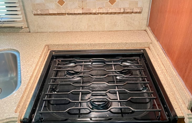 3 burner stovetop, microwave and convection oven in kitchen!