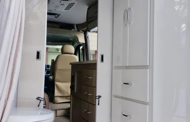 Storage closet to hang clothes and drawers